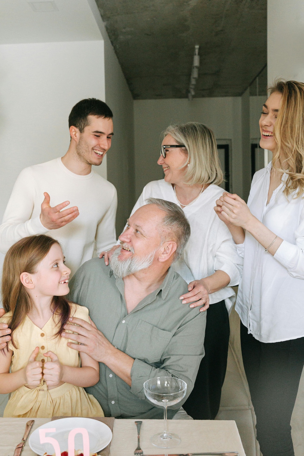 Family gathering with people laughing together
